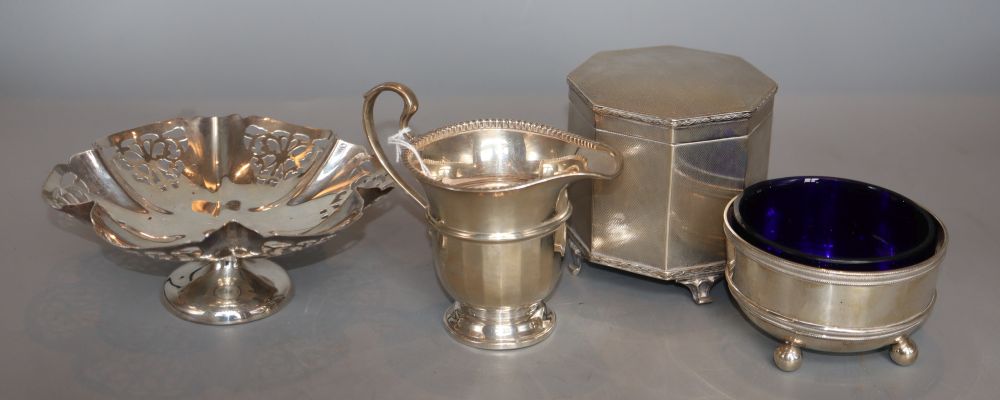 A silver engine-turned cigarette box, a silver bowl, a cream jug and a pierced tazza.